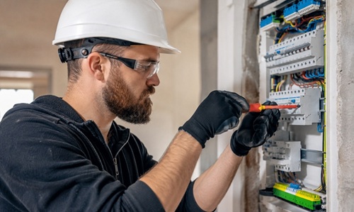 One of our own qualified electricians working on a consumer unit